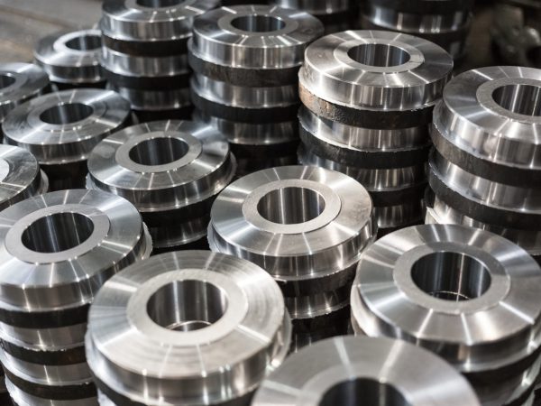 Rollers, rollers, bushings - billet obtained on a lathe from steel and cast iron. Many of the same parts stacked in the shop machine factory. Expect further processing.; Shutterstock ID 443670568; Purchase Order: -